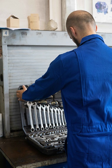 Professional HVAC technician using tools